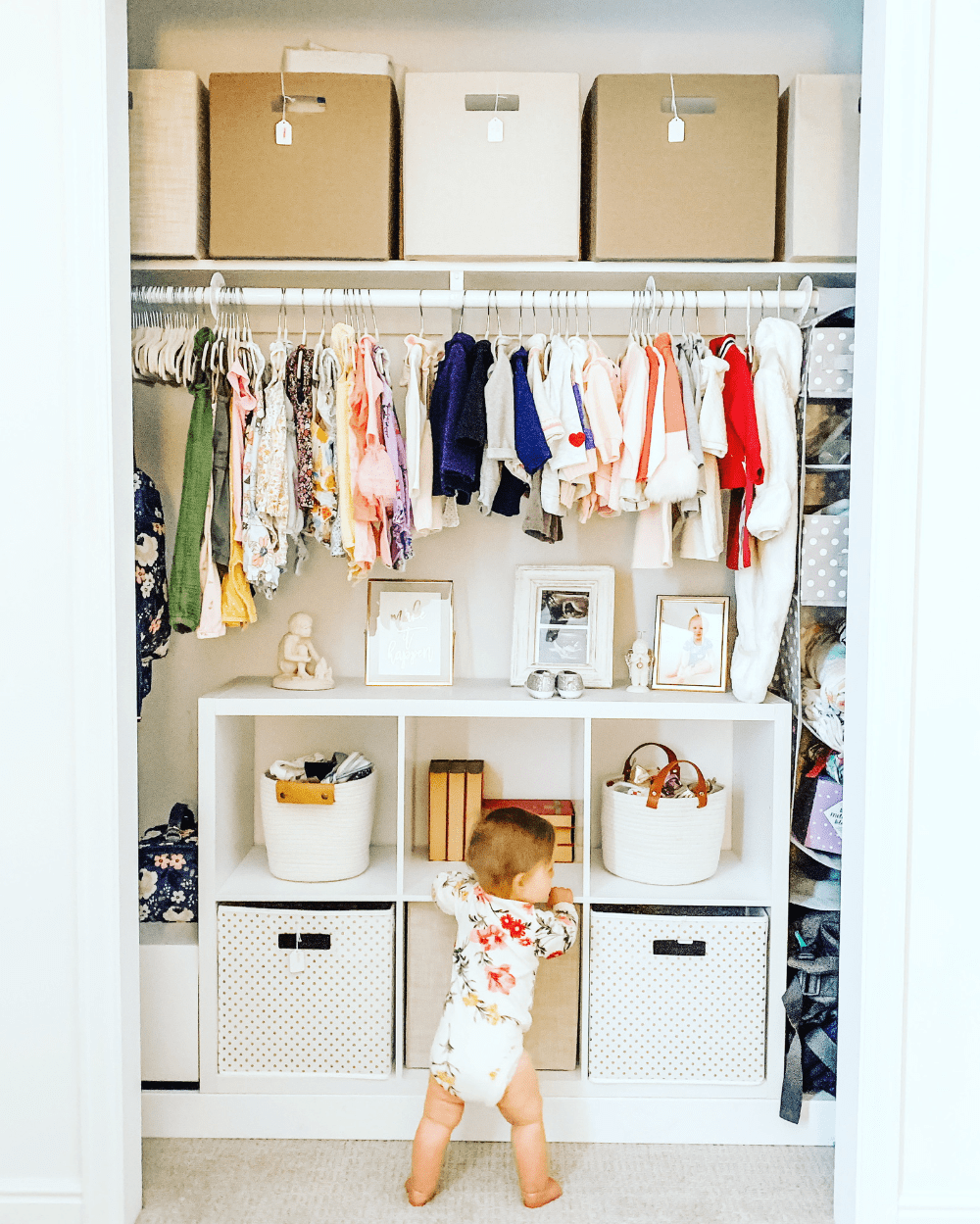 Baby wardrobe showing shelves, drawers, and safe rounded design features in a nursery.