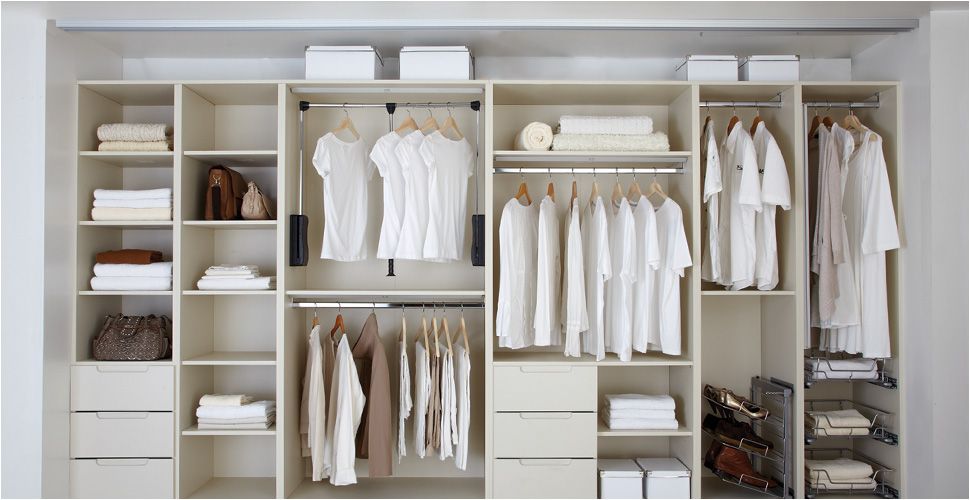 Interior storage options inside a fitted wardrobe with shelves and hanging rails and learn what is a fitted wardrobe.
