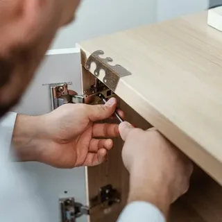 how to adjust wardrobe door hinges step by step using a screwdriver.