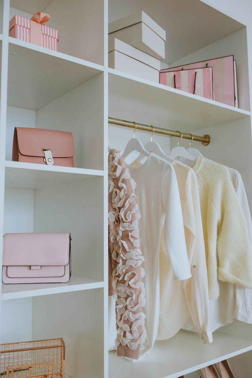 how to maximise wardrobe space using storage boxes and smart organisers on shelves.