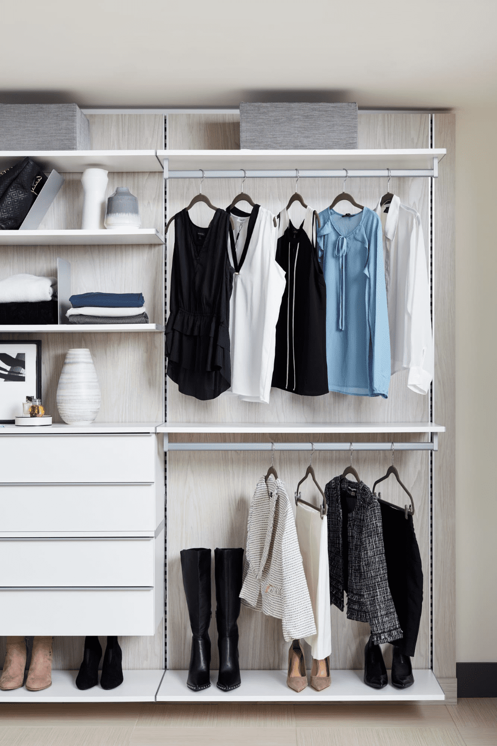 Open floating wardrobe with shelves and hanging space for minimalist bedroom storage.