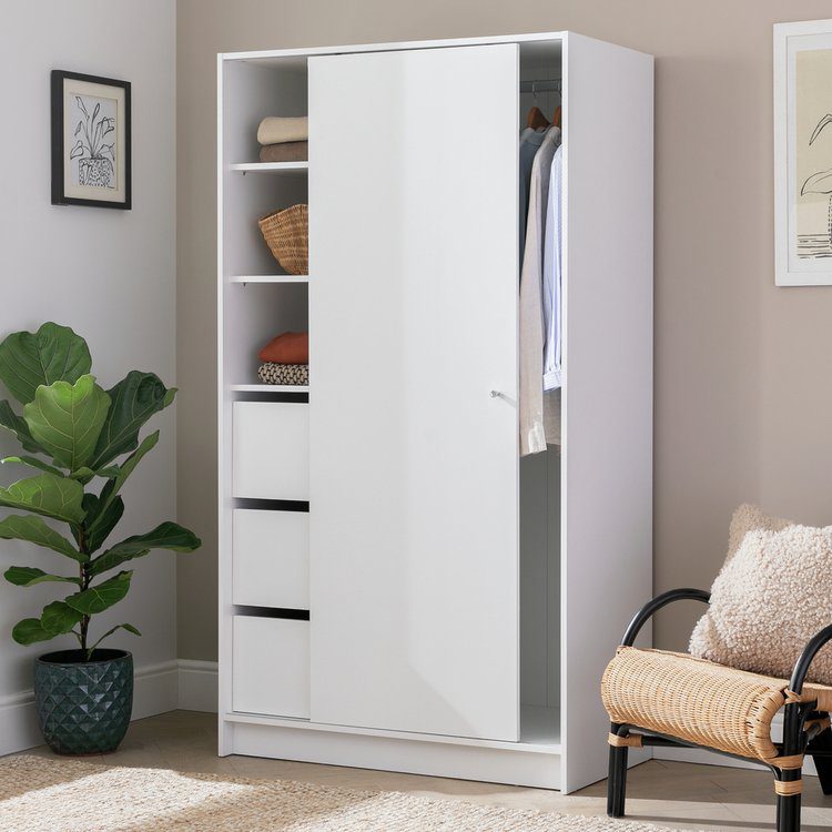 White slimline wardrobes with sliding doors designed for compact bedrooms and smart storage.