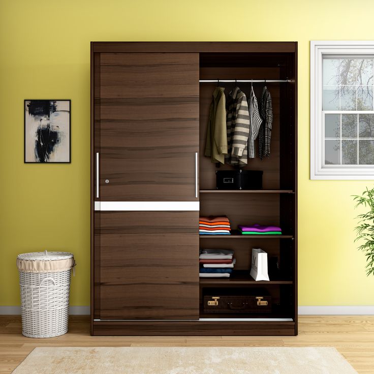 Wooden slimline wardrobes with sliding doors ideal for compact bedrooms.